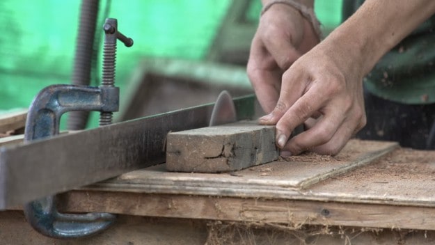 Weros-house-working-on-saw1